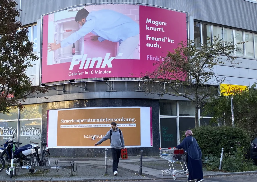 A billboard advertisement for the delivery service Flink in Berlin uses what's called the "gender star" in the word Freund*in, a gender-neutral word for romantic partner. 
Esme Nicholson/NPR
